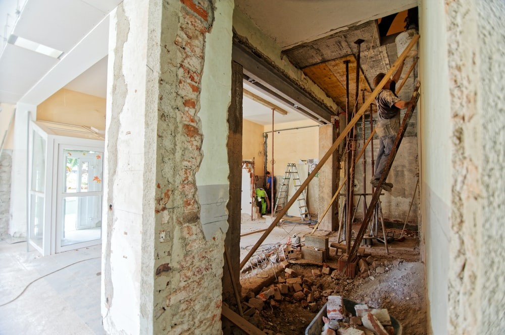 Contractors remodeling an old property